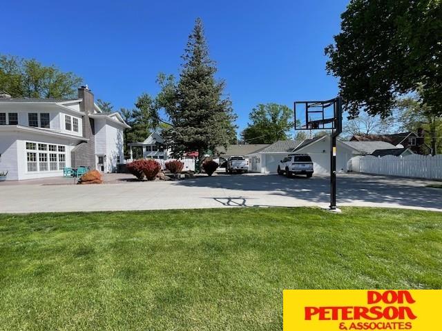 1638 N Nye Ave, Fremont, NE 68025 - view of yard featuring driveway and fence