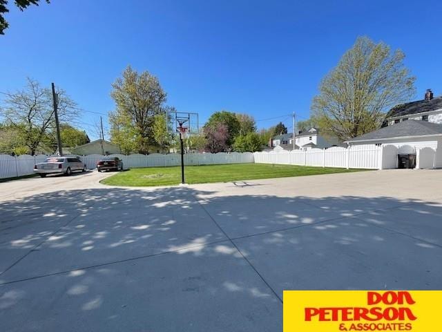 1638 N Nye Ave, Fremont, NE 68025 - view of basketball court with a yard and fence