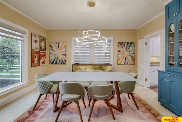 1638 N Nye Ave, Fremont, NE 68025 - dining space featuring a notable chandelier and crown molding