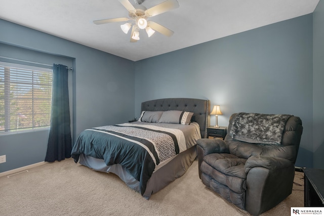 bedroom featuring baseboards, a ceiling fan, and carpet floors