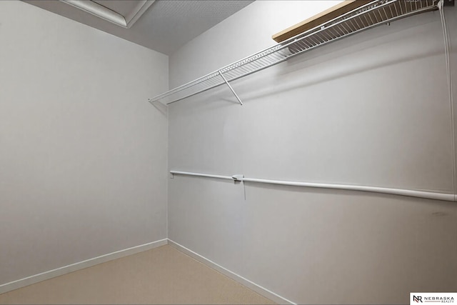 spacious closet with attic access