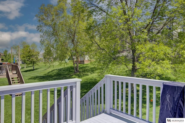 deck with a lawn and stairs