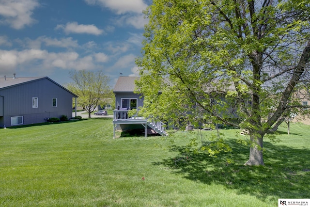 view of yard featuring a wooden deck