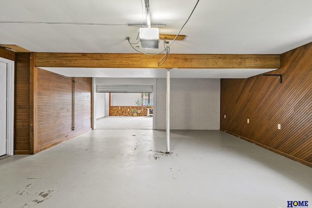 interior space with wooden walls and a garage door opener