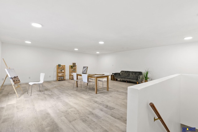 game room featuring baseboards, light wood-style floors, and recessed lighting