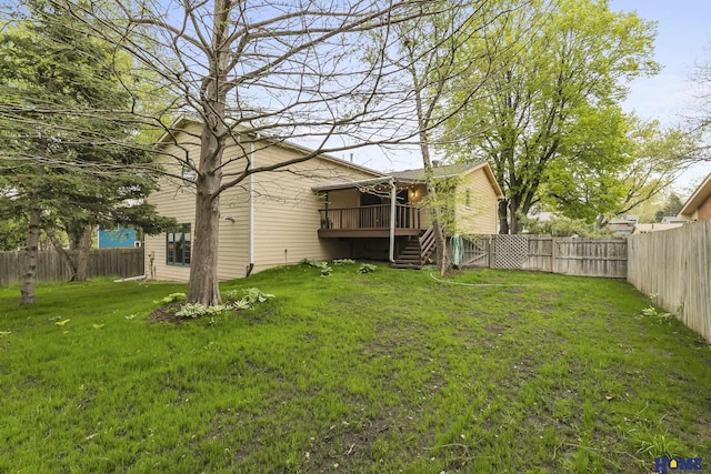 view of yard featuring stairs, a wooden deck, and a fenced backyard