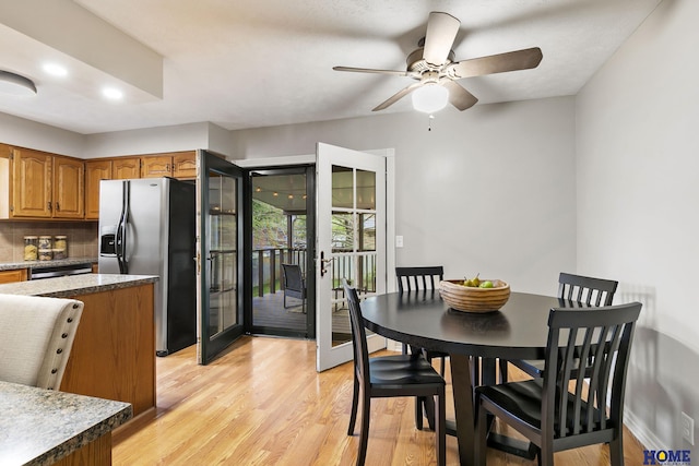 dining space featuring light wood-type flooring, french doors, a ceiling fan, and recessed lighting