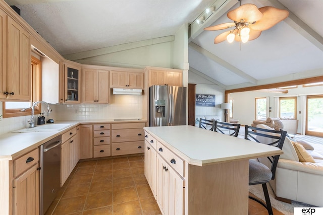 S-1129 Platte Shore Dr, Fremont, NE 68025 - kitchen featuring appliances with stainless steel finishes, a sink, light brown cabinets, open floor plan, and a kitchen breakfast bar