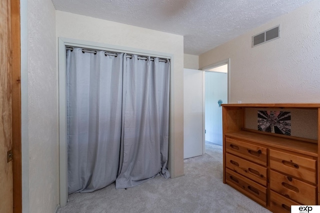 S-1129 Platte Shore Dr, Fremont, NE 68025 - spare room with light carpet, a textured ceiling, and a textured wall