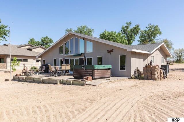 S-1129 Platte Shore Dr, Fremont, NE 68025 - rear view of property featuring a hot tub and a patio area