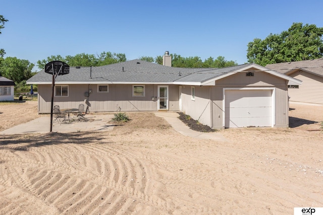 S-1129 Platte Shore Dr, Fremont, NE 68025 - single story home with an attached garage, a chimney, and roof with shingles