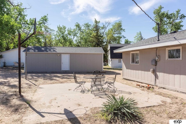 S-1129 Platte Shore Dr, Fremont, NE 68025 - view of patio featuring an outbuilding