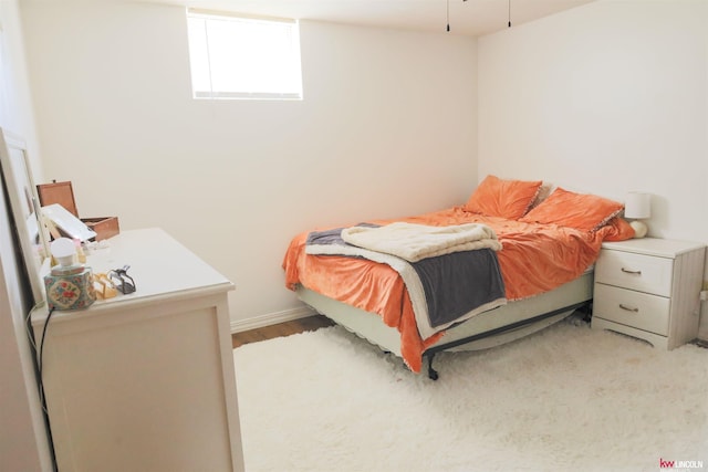 bedroom with wood finished floors
