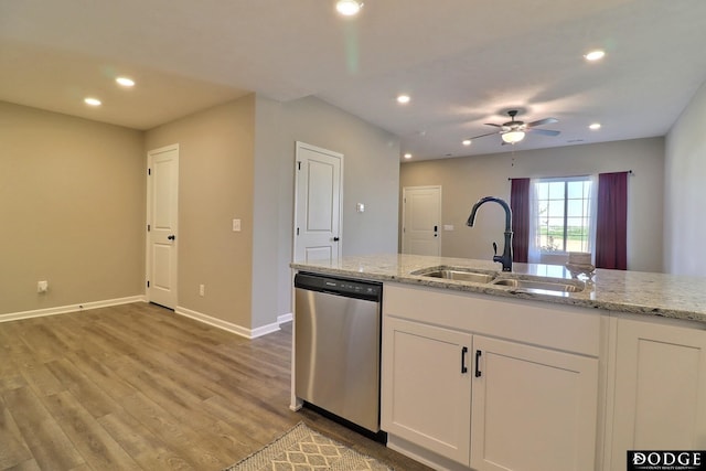 kitchen with a sink, recessed lighting, a ceiling fan, stainless steel dishwasher, and baseboards
