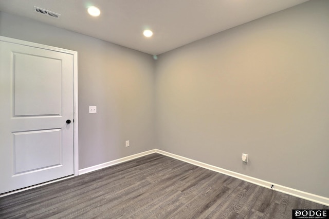 unfurnished room featuring baseboards, recessed lighting, dark wood finished floors, and visible vents
