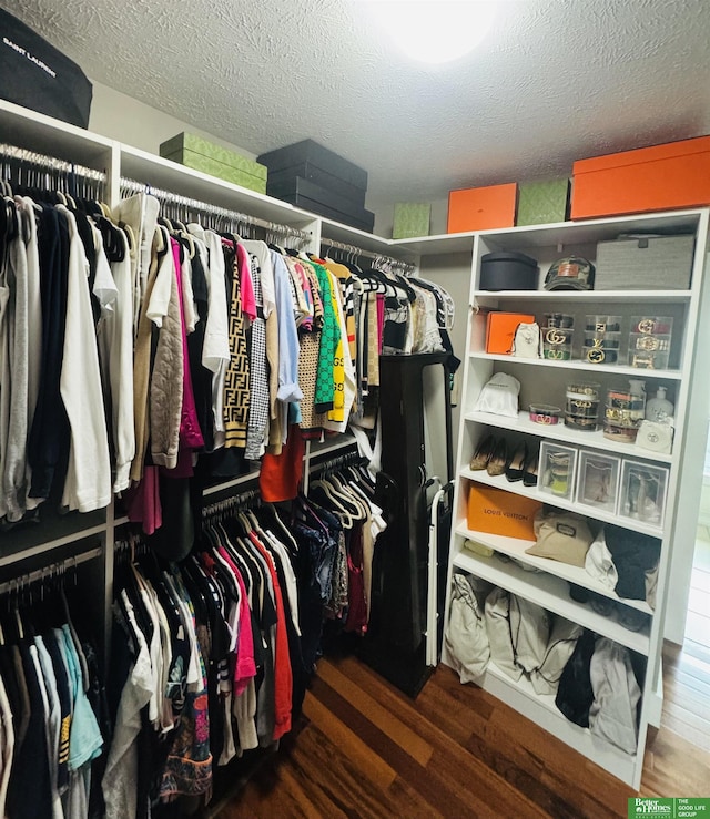 spacious closet with wood finished floors