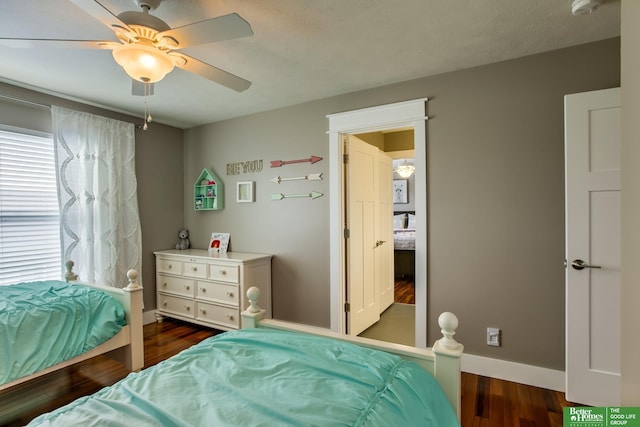 bedroom featuring baseboards, a ceiling fan, and dark wood-type flooring