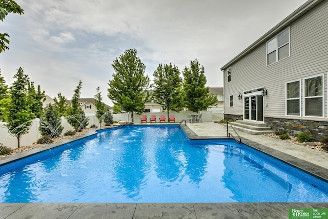 view of pool with a patio, a fenced in pool, and a fenced backyard