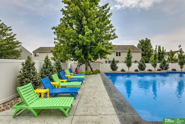 view of swimming pool with a fenced in pool and a fenced backyard