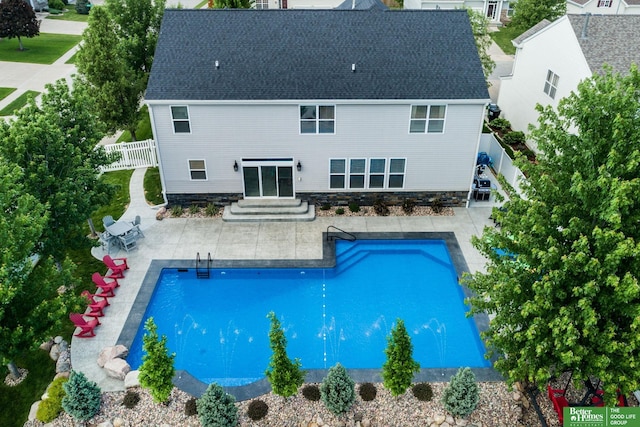 view of pool with a patio area, entry steps, a fenced in pool, and a fenced backyard