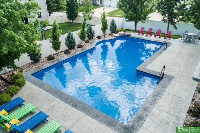 view of pool featuring a patio area, a fenced in pool, and a fenced backyard