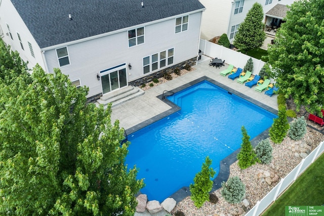 view of pool with a patio, entry steps, a fenced in pool, and a fenced backyard