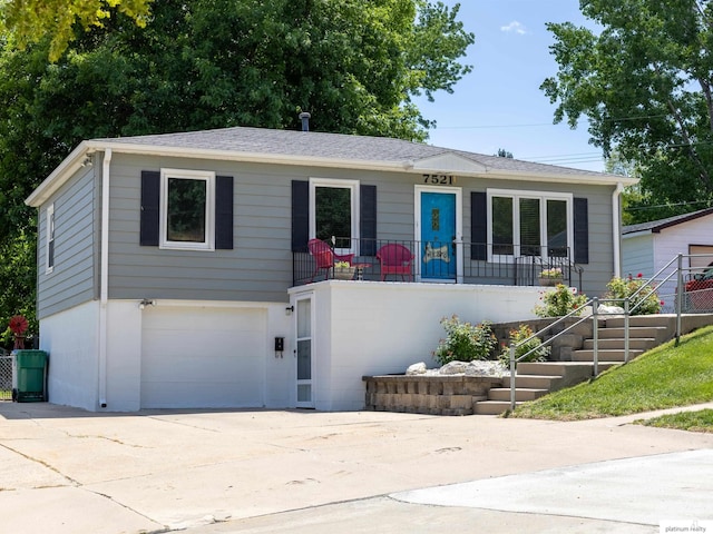 7521 Edward Ave, La Vista, NE 68128 - view of front facade featuring stairs, a garage, and driveway