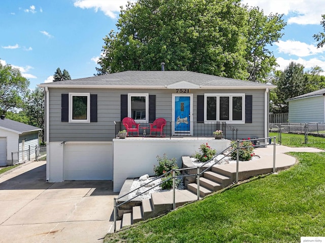 7521 Edward Ave, La Vista, NE 68128 - view of front of property featuring concrete driveway, an attached garage, and stairway