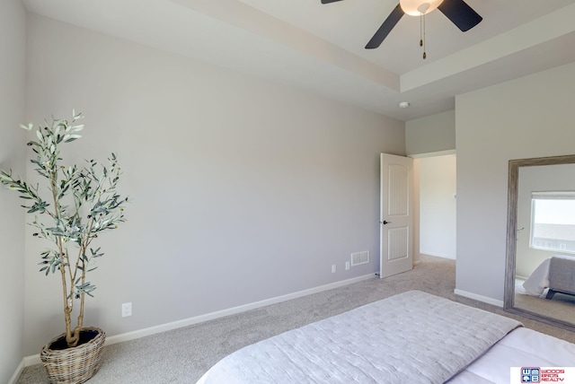 bedroom with light colored carpet, baseboards, ceiling fan, and visible vents