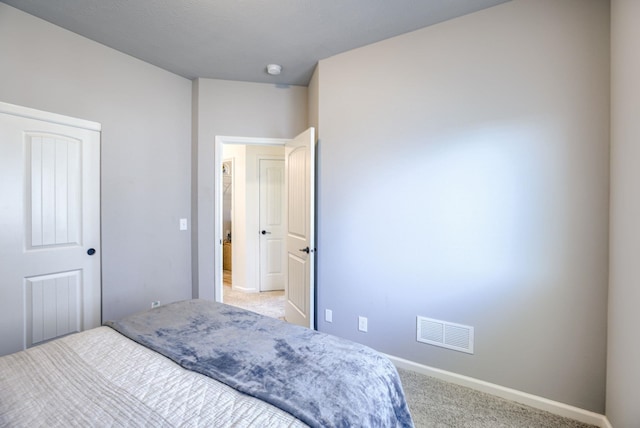 bedroom featuring carpet flooring, visible vents, and baseboards