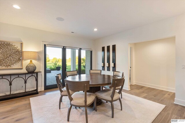 501 S 243rd St, Waterloo, NE 68069 - dining space with baseboards, wood finished floors, and recessed lighting