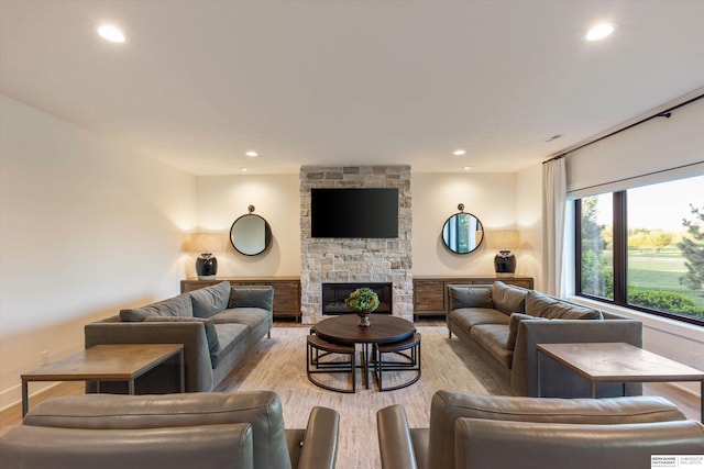 501 S 243rd St, Waterloo, NE 68069 - living area featuring light wood-type flooring, recessed lighting, and a stone fireplace