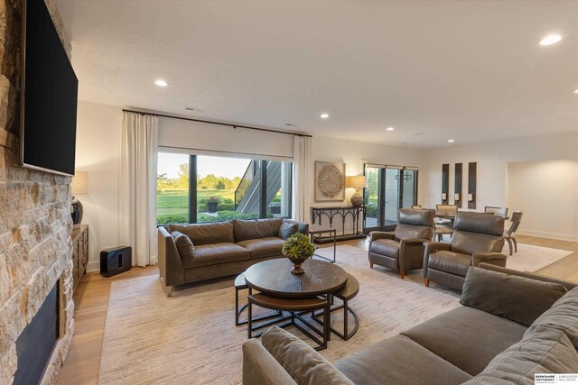 501 S 243rd St, Waterloo, NE 68069 - living room featuring a fireplace, recessed lighting, light wood-style floors, and baseboards