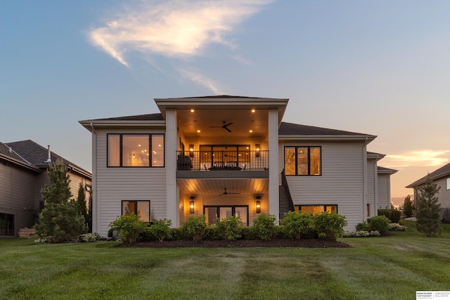 501 S 243rd St, Waterloo, NE 68069 - rear view of house with a balcony, ceiling fan, and a lawn