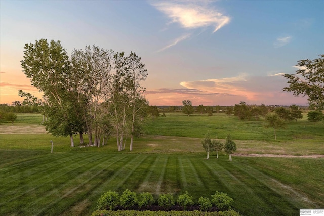 501 S 243rd St, Waterloo, NE 68069 - yard at dusk featuring a view of rural / pastoral area and a lawn