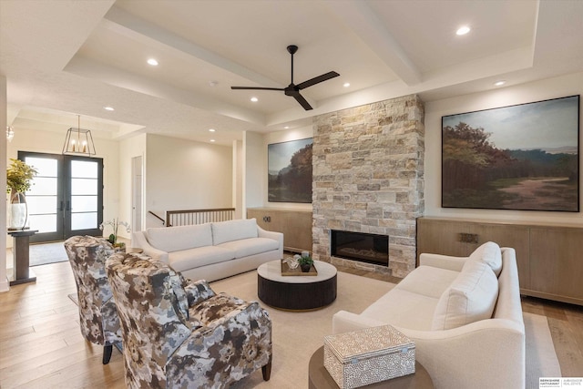 501 S 243rd St, Waterloo, NE 68069 - living area featuring ceiling fan, wood finished floors, recessed lighting, beamed ceiling, and a stone fireplace
