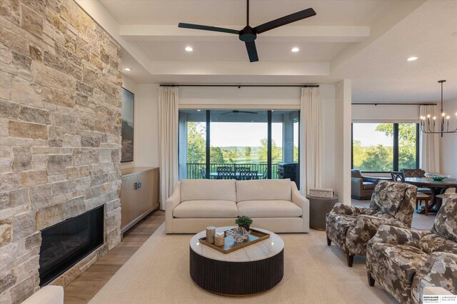 501 S 243rd St, Waterloo, NE 68069 - living room featuring a ceiling fan, a fireplace, a chandelier, recessed lighting, and wood finished floors