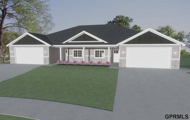 view of front facade with stone siding, driveway, and a front yard