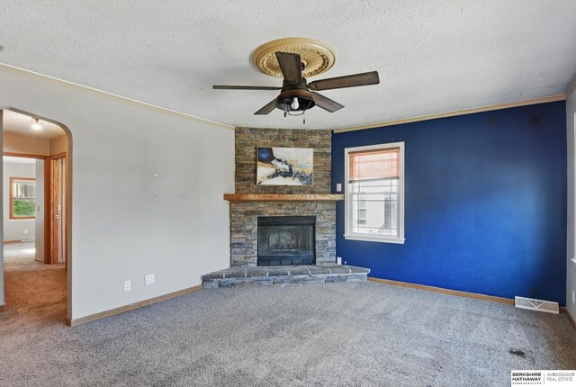 6523 Emmet St, Omaha, NE 68104 - unfurnished living room with a ceiling fan, a textured ceiling, carpet, ornamental molding, and arched walkways