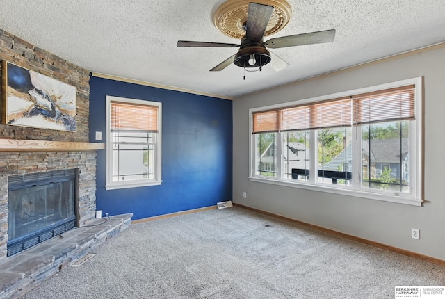 6523 Emmet St, Omaha, NE 68104 - unfurnished living room featuring a textured ceiling, carpet floors, a ceiling fan, and baseboards