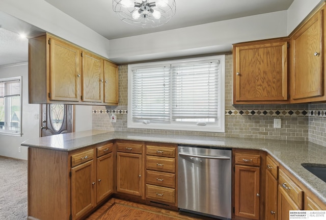 6523 Emmet St, Omaha, NE 68104 - kitchen with a peninsula, dishwasher, tasteful backsplash, and brown cabinets