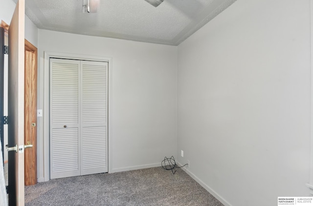 6523 Emmet St, Omaha, NE 68104 - unfurnished bedroom with a textured ceiling, baseboards, a closet, and carpet floors