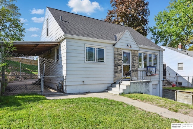 6523 Emmet St, Omaha, NE 68104 - view of front of home featuring a front yard, roof with shingles, and fence