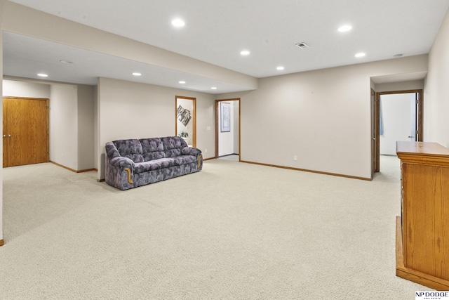 living area with light colored carpet, baseboards, and recessed lighting
