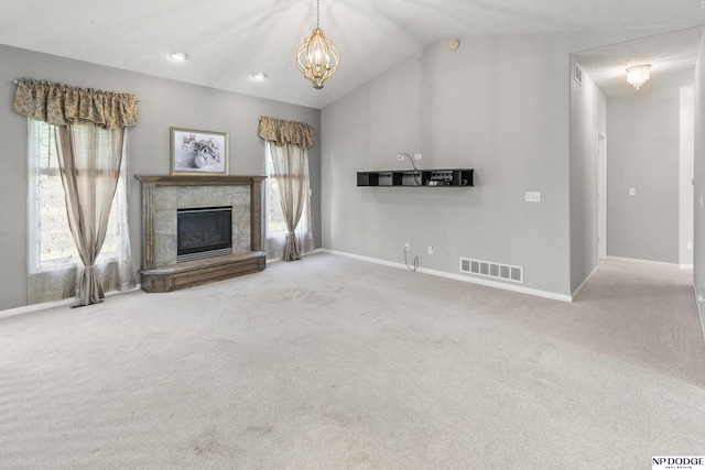 unfurnished living room featuring baseboards, carpet flooring, visible vents, and vaulted ceiling