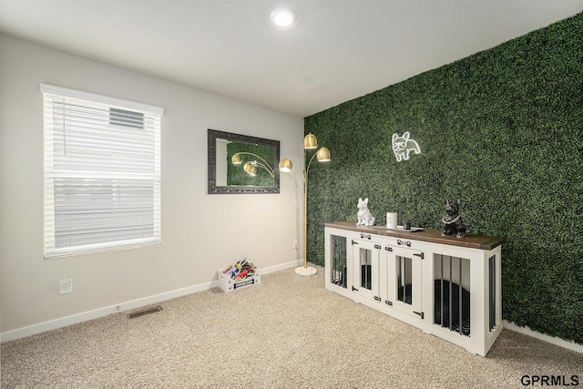 rec room with baseboards, carpet flooring, and visible vents