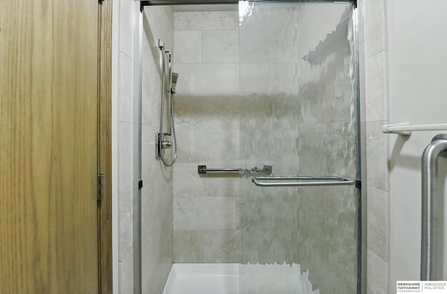 bathroom featuring a shower stall