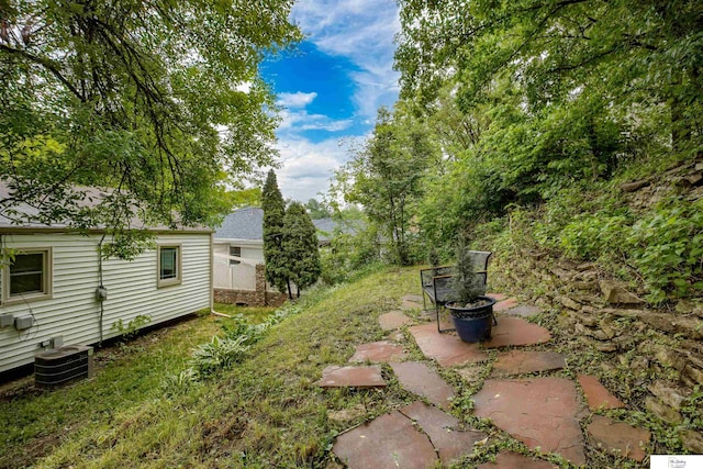 7545 Sherman Dr, Omaha, NE 68134 - view of yard featuring central AC unit and a patio area