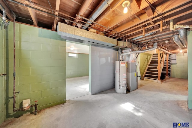 unfinished below grade area featuring stairs and gas water heater