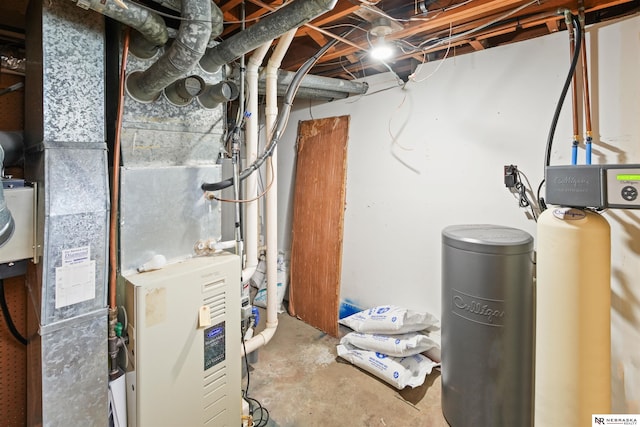 utility room featuring heating unit